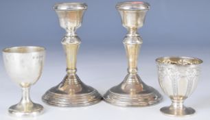 Pair of Elizabeth II hallmarked silver candlesticks, Birmingham 1978, maker W I Broadway & Co,