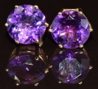 A pair of 9ct gold earrings each set with a round cut amethyst of approximately 1.8ct, 2.2g