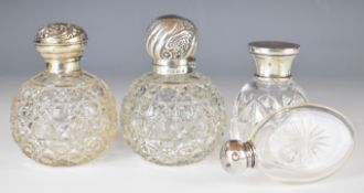 Four various hallmarked silver lidded dressing table items comprising two globe shaped hobnail cut