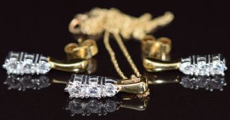 An 18ct gold pendant set with three graduating diamonds of approximately 0.17, 0.13 & 0.09ct and
