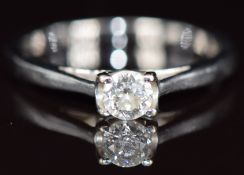 An 18k white gold ring set with a round cut diamond of approximately 0.3ct with 'Forever' engraved