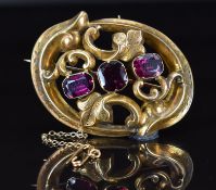 Victorian 9ct gold brooch with scrolling design and engraved floral decoration, set with three