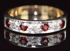 A 9ct gold ring set with garnets and diamonds, 3g, size L