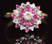 A 9ct gold ring set with diamonds and rubies in a cluster, 2.2g, size P