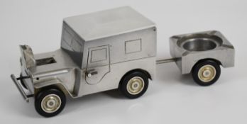 Novelty aluminium smoking compendium comprising jeep containing cigarette box to top and table