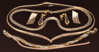 Two 9k tri-coloured gold necklaces, a pair of 9ct tri-coloured gold earrings, a 9ct gold tri-