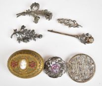 Three silver brooches set with marcasite, Scottish silver brooch set with an amethyst, a Scottish