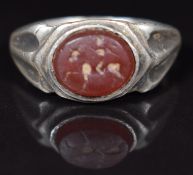 Roman ring set with a carnelian agate intaglio of a man on horse back, 8g