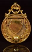 A 9ct gold football fob/ medallion, engraved verso U.S.L. Chatham 1922-23 winners R.N.Dept, 8.2g,