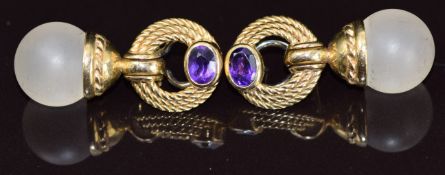 A pair of 9ct gold earrings each set with a crystal bead and oval cut amethyst, 22.9g