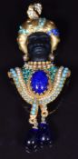 Askew of London brooch in the form of a blackamoor woman wearing a turban and jewelled collar, 9 x