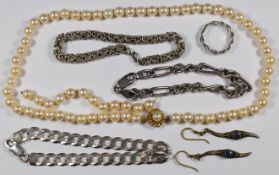 A single strand of cultured pearls with a 14k gold clasp (each bead approximately 7.2mm), two silver