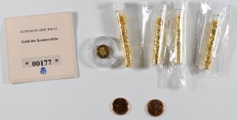 Two 2022 Gibraltar quarter sovereigns, four small tubes of gold leaf and a 0.5g 333 miniature gold