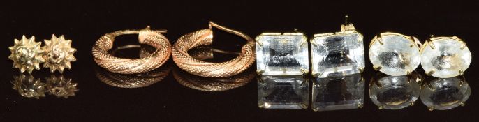 Two pairs of 9ct gold earrings (1g) and two pairs of yellow metal earrings set with aquamarines (