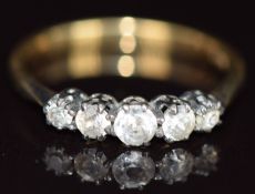 An 18ct gold ring set with paste, 1.9g, size L