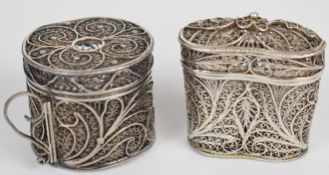 Filigree silver novelty scent bottle holder, the hinged lid opening to reveal a pair of cut glass