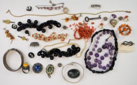 A collection of jewellery including 9ct gold clip (1.8g), amethyst beaded necklace, silver bangle,
