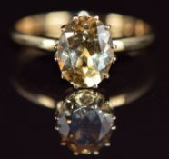 A 9k gold ring set with an oval cut heliodor of approximately 1.5ct, 1.8g, size N
