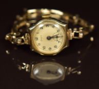 Frey 9ct gold ladies wristwatch with subsidiary seconds dial, blued hands, black Arabic numerals,