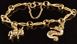 An 18ct gold bracelet made up of circular and figure of eight links, with two Mexican 14k gold