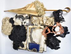 A continental olive wood silk and lace parasol, lace, beaded, sequinned and embroidered remnants and