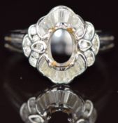 An 18k white gold ring set with round and baguette cut diamonds (missing centre stone), 4.2g, size