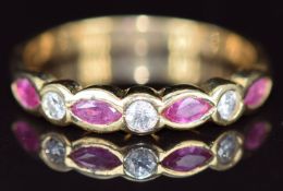 An 18ct gold ring set with marquise cut pink sapphires and diamonds, 2.8g, size O