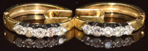 A pair of 18k earrings each set with five round cut diamonds, 4.5g
