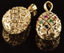 A 14k gold egg pendant set with cubic zirconia (3.1g) and a 9k gold egg pendant set with