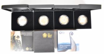 Four Royal Mint silver proof £5 crown coins including Churchill, Viking King, Queen Elizabeth II