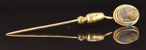Victorian yellow metal stick pin set with a lava cameo, in antique box