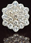 An 18ct white gold ring set nineteen round cut diamonds, each approximately 0.32ct, in a hexagonal
