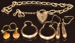 A 9ct gold bracelet with heart padlock clasp and three pairs of 9ct gold earrings including