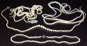 A double strand natural seed pearl necklace with 9ct gold clasp, two single stands of natural pearls