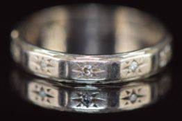 An 18ct white gold eternity ring set with diamonds, 2.5g, size K