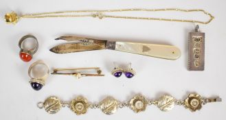 A collection of silver including bracelet, two rings, earrings, penknife, ingot etc