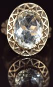 A 9ct gold ring set with an oval cut quartz in a pierced setting, 5.8g, size R