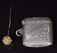 A yellow metal stick pin set with turquoise cabochons, with hinged top opening to reveal a locket