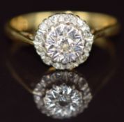 An 18ct gold ring set with diamonds in a cluster, 3.1g, size J