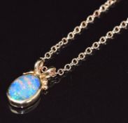 An 18ct rose gold pendant set with a black opal doublet (1.8cm) on 18ct rose gold chain, 7.4g, 44cm