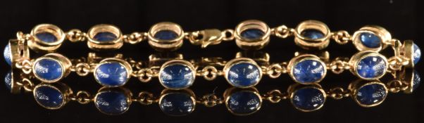 A 9ct gold bracelet set with sapphire cabochons, 9.9g, 18cm