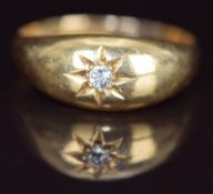 An 18ct gold ring set with a diamond in a star setting, Birmingham 1911, 2.8g, size O