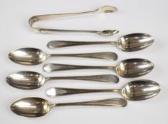 George V hallmarked silver set of six teaspoons and sugar nips with beaded edge decoration,