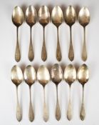 Walker & Hall set of twelve hallmarked silver dessert spoons with zig zag border, various 1930s