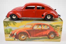 Distler clockwork pressed tin Split Window VW Beetle with red body, silver hubs and D-3070