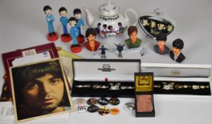 A collection of Beatles ephemera to include lead figures, resin busts, alarm clock, Cavern brick