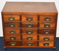 Collector's chest of fifteen drawers with campaign style handles, W71.5 x D41 x H60cm