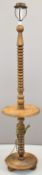 Oak bobbin turned standard lamp with surround shelf, height 178cm
