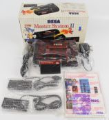 Sega Master System II retro computer gaming console complete with two controllers, power supply,