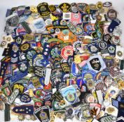 Large collection of overseas cloth and metal police badges and rank insignia including Spain,
